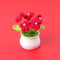 Close-up of handmade red crochet flowers with pearl centers in a white ceramic pot - Red Forget-Me-Not (5 Pearl Heads) Potted Plant