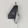 Matte black number 4 birthday candle with white base on neutral background - Number 4 / Black and Gray
