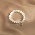 Macro detail of cat eye stone beaded bracelet with gold star charm and micro diamonds - Gold-8mm