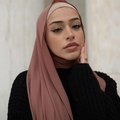 Elegant dusty pink pearl chiffon long hijab scarf worn by a model in black - Rouge Red