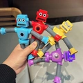 Close-up of four colorful telescopic suction cup robot toys with flexible limbs - No Light Version / Suction Robot