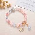 Close-up of pink and blue beaded crystal bracelet with white daisy pendant on beige texture - Daisy Style 1 / Multicolor