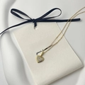 Close-up of heart pendant necklace in 18K gold plating with full zircon stones - 925 Silver / 18K Gold
