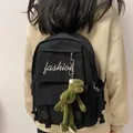 Black canvas backpack with fashion text and green frog charm for casual school style - With Frog Pendant / Black