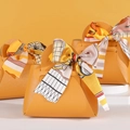 Mini orange leather favor bag with patterned silk scarf handle for wedding gifts - Yellow
