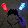 Halloween LED headband with black bat frame and red-blue glowing skulls on springs - Bat Skeleton Headband