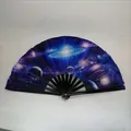 Handheld folding fan featuring a vibrant dark blue and purple galaxy starry sky pattern - Galaxy Starry Sky A6