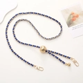 Close-up of blue leather and gold metal woven strap with spherical bead for phone case - Royal Blue