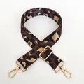 Detail of coffee leopard print nylon bag strap with polished gold swivel hooks - Coffee + Gold Hook