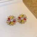 Close-up of golden flower earrings with colorful zircons on a beige jewelry cushion - 9# Multi-color Silver Earring Post Zircon Flower Stud Earrings (Real Gold Plated)