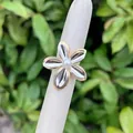 Adjustable 18K gold plated flower ring with artificial pearl center and silver petals - Gold And Silver Toned Floral Style