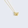Gold pendant necklace featuring a letter W design inlaid with delicate small pearls - Letter W