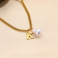 Elegant gold K letter necklace featuring a white baroque pearl on a fine chain - Letter K Necklace