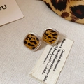 Detailed close-up of square leopard print stud earrings with silver metal edges - Silver Edge Leopard Square (Silver Earring Post)