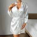 Elegant white satin robe for women with belt and tassel details in a bedroom setting - S / White