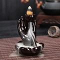 Ceramic lotus hand backflow incense burner in dark brown glaze on a tea set - Bergamot Lotus