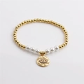 Pulsera elástica dorada con perlas blancas y colgante de ojo turco con circonitas - Dorado con perla blanca