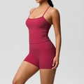 Detail view of burgundy yoga set with side pocket on shorts and slim racerback tank top - S / Top And Bottom - Carmine Red