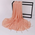 Close-up of pink-orange chiffon shawl featuring delicate pearls and gold pin accents - 175cm / Champagne Pink