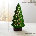 Green LED Christmas tree lamp with hollow snowflake patterns and a dark wood base - Green Christmas Tree
