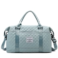 Light blue quilted travel bag with dual handles and detachable shoulder strap on white background - Large / Mountain Blue