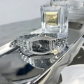 Macro view of tonneau emerald quartz watch with silver metal strap and rhinestone bezel - Silver Band Black Dial