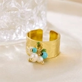 Detail of wide gold ring with white pearls, turquoise beads and green stones on silk background - R00896G (Hammered Wide Band + Turquoise + Green Beads + Pearl)