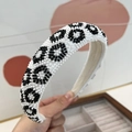 Detail of handcrafted black and white beaded leopard pattern headband with high crown - 3cm Sponge Headband / White Leopard Print