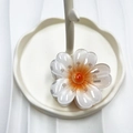 Gradient white and orange flower claw clip hair accessory on wavy texture tray - Orange (Lucky Flower)