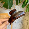 Close-up of a tortoiseshell hair claw clip in dark brown resin for long hair styling - 10cm Yuanbao Claw / Matte Red Brown