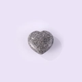 Polished heart-shaped natural stone pendant in grey granite texture with smooth finish - Granite