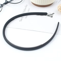 Minimalist black matte headband with non-slip teeth for secure and comfortable hair styling - Black