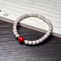 Star Moon Bodhi seed bracelet with red bead and metal spacers on a vintage background - Star Moon Bracelet (Imitation Cinnabar)