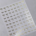 Golden minimalist bow nail art stickers featuring elegant metallic finish, model M-280 - Gold Bowknot (M-280)