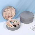 Portable round grey leather jewelry box with zipper and soft beige velvet interior - 10x5cm / Gray