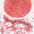 2mm pink glass seed beads in small white bowl for handmade jewelry and DIY crafts - Deep Pink