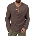 Detail of dark brown Henley shirt texture with white buttons and waffle knit fabric - Brown