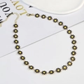 Minimalist daisy necklace with black and yellow floral charms in a gold finish - Large Flower Necklace / Black