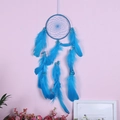 Handmade electric blue dream catcher with vibrant feathers and beads on pink background - MS6021D Blue 13cm
