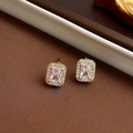 Close-up of golden square zircon halo earrings with rectangle crystal and small round stones - Stud Earrings Pair (925 Silver Pin - Gold)