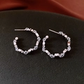 Macro shot of silver C-shaped hoop earrings featuring geometric zircon stones on black velvet - Silver (Silver Pin) / Silver