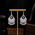 Ethnic style silver-colored hollow leaf tassel drop earrings on a display stand - Silver Multi-Hole Hollow Carved Metal Ball Tassel Style (E2051-4)