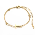 Double-layered golden stainless steel chain bracelet featuring a minimalist letter T charm - Letter T
