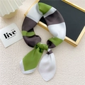Elegant green and grey patchwork silk scarf tied in a bow with soft satin finish - 29 Patchwork Stripe Green