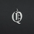 Detailed close-up of a silver Gothic style letter Q pendant in polished stainless steel - Letter Q