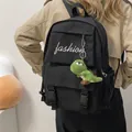 Black canvas backpack for students with fashion text and green dinosaur plush pendant - With Dinosaur Pendant / Black