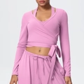 Detail of pink yoga set featuring a V-neck wrap top and high-waist drawstring pants - Rose Pink
