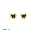 Macro shot of gold heart earrings with black butterfly, dimensions 1.2cm x 1.5cm, weight 6.2g - Black Butterfly