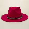 Close-up of fuchsia felt fedora hat featuring black ribbon and gold chain detail - M (56-58cm) / Red
