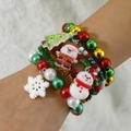 Weihnachts-Perlenarmband-Set mit Weihnachtsmann- und Tannenbaum-Anhängern in Rot-Grün - 4-teiliges elastisches Perlenset / Rot/Weiß/Grün